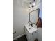 Bathroom with modern vanity, decorative lighting, and a sleek mirror for a contemporary feel at 407 Tiger Lily Way, Henderson, NV 89015