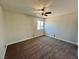 Neutral bedroom with a window, carpet, and ceiling fan providing a simple yet comfortable atmosphere at 407 Tiger Lily Way, Henderson, NV 89015