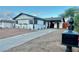 Inviting single-story home with a long driveway, mature landscaping, and decorative flower boxes at 407 Tiger Lily Way, Henderson, NV 89015