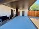 Cozy outdoor entryway featuring a bench, painted concrete, and well-maintained landscaping at 407 Tiger Lily Way, Henderson, NV 89015