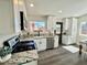 Updated kitchen with stainless steel appliances, granite countertops, and ample cabinet space at 407 Tiger Lily Way, Henderson, NV 89015
