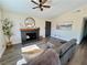 Cozy living room featuring a fireplace, comfortable seating, and natural light at 407 Tiger Lily Way, Henderson, NV 89015