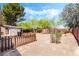 The backyard has desert landscaping, a shed, and a brick wall at 429 Scenic Dr, Henderson, NV 89002