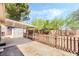 The backyard shows a shed with an awning along with a fence and desert landscaping at 429 Scenic Dr, Henderson, NV 89002