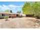 The backyard showcases a desert landscape, a shed, and a fence at 429 Scenic Dr, Henderson, NV 89002