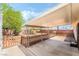 Spacious backyard featuring a covered patio, a wooden fence and partial landscaping at 429 Scenic Dr, Henderson, NV 89002