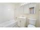 Bathroom with a bathtub and shower combination, a vanity with a single sink, and a mirrored medicine cabinet at 429 Scenic Dr, Henderson, NV 89002