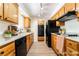 Classic kitchen featuring wooden cabinets and modern appliances at 429 Scenic Dr, Henderson, NV 89002