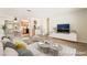 Inviting living room that flows into dining area with hardwood floors at 429 Scenic Dr, Henderson, NV 89002