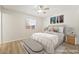 Relaxing bedroom features soft lighting, a ceiling fan, and hardwood floors at 429 Scenic Dr, Henderson, NV 89002