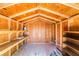 The interior of the shed shows shelving and a wooden roof and walls at 429 Scenic Dr, Henderson, NV 89002