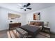Bedroom with modern decor, neutral color scheme, a decorative bench and dresser at 4442 Bennett Dr, Las Vegas, NV 89121