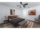 Bedroom with a contemporary design featuring warm lighting, artwork, and stylish furniture at 4442 Bennett Dr, Las Vegas, NV 89121