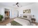 Bright bedroom includes modern decor, ceiling fan, and a walk-in closet at 4442 Bennett Dr, Las Vegas, NV 89121