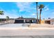 Charming single-story home with a dark-gray two-car garage and low maintenance desert landscaping at 4442 Bennett Dr, Las Vegas, NV 89121