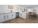 Kitchen with white cabinets, stainless steel appliances, stone countertops and wood floors at 4442 Bennett Dr, Las Vegas, NV 89121