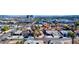 An aerial view of a residential neighborhood highlighting a house with palm trees, close to nearby businesses at 4681 Via San Rafael, Las Vegas, NV 89103