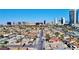 An aerial view showing a single-story home nestled within a suburban neighborhood, city view in the background at 4681 Via San Rafael, Las Vegas, NV 89103