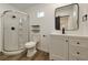 Modern bathroom featuring a glass-enclosed shower, sleek vanity, and matte black hardware at 4681 Via San Rafael, Las Vegas, NV 89103