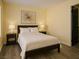 Bedroom features neutral-colored walls, hardwood floors, and two bedside tables with lamps at 4681 Via San Rafael, Las Vegas, NV 89103