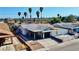 Aerial shot of home with sleek black and white exterior, covered patio, and desert landscaping at 4681 Via San Rafael, Las Vegas, NV 89103