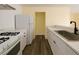 This kitchen features white countertops and stainless steel appliances at 4681 Via San Rafael, Las Vegas, NV 89103