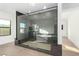 A modern bathroom features a large walk-in shower with glass enclosure and tile surround at 5725 El Royale Ct, Las Vegas, NV 89149