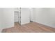 A serene bedroom is bright and has wood floors at 5725 El Royale Ct, Las Vegas, NV 89149