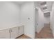 Hallway with white walls and cabinets and beautiful hardwood floors at 5725 El Royale Ct, Las Vegas, NV 89149