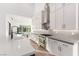 Bright kitchen featuring a large island with seating, stainless appliances, and modern fixtures at 5725 El Royale Ct, Las Vegas, NV 89149