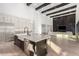 Bright, open kitchen featuring an island with seating and stainless steel appliances at 5725 El Royale Ct, Las Vegas, NV 89149