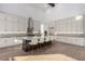 Well-lit kitchen boasts an island with seating, stainless steel appliances, and ample storage space at 5725 El Royale Ct, Las Vegas, NV 89149