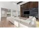 Open living room with a modern fireplace, wood floors and high ceilings at 5725 El Royale Ct, Las Vegas, NV 89149
