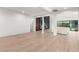 Expansive open living space featuring hardwood floors, modern fireplace, and a comfortable sectional at 5725 El Royale Ct, Las Vegas, NV 89149