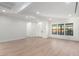 Bright open-concept living room featuring hardwood floors, large windows, and modern design at 5725 El Royale Ct, Las Vegas, NV 89149