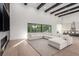 Spacious living room with high ceilings, modern fireplace, and an oversized sectional sofa at 5725 El Royale Ct, Las Vegas, NV 89149