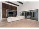 A spacious living room has high ceilings, wood accents, and an impressive fireplace at 5725 El Royale Ct, Las Vegas, NV 89149