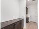 Mudroom features dark cabinets, white walls, hardwood floors and white doors at 5725 El Royale Ct, Las Vegas, NV 89149