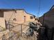 This backyard is spacious with a gate and needs some clean up to realize its full potential at 613 Buchanan Ave, Henderson, NV 89015
