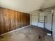 This bedroom features paneled walls, a drop ceiling, and ample space, awaiting your personal touch at 613 Buchanan Ave, Henderson, NV 89015
