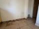 Damaged wall with rotted drywall and baseboards, exposed plumbing at 613 Buchanan Ave, Henderson, NV 89015
