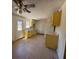 Bright kitchen with tile flooring and yellow cabinets at 613 Buchanan Ave, Henderson, NV 89015