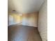 Spacious living room with tile flooring and a white brick accent wall at 613 Buchanan Ave, Henderson, NV 89015