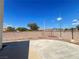 Open backyard with concrete patio area and perimeter brick wall at 7748 Catalina Harbor St, Las Vegas, NV 89131