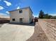 A spacious backyard with a concrete patio and a view of the two-story home at 7748 Catalina Harbor St, Las Vegas, NV 89131