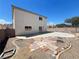 Backyard view featuring concrete patio, rock landscaping, and the exterior of the two-story home at 7748 Catalina Harbor St, Las Vegas, NV 89131