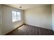 Bedroom with plush carpeting and a large window offering natural light at 7748 Catalina Harbor St, Las Vegas, NV 89131