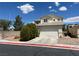Two story home featuring a driveway leading to a two-car garage and a detached one-car garage at 7748 Catalina Harbor St, Las Vegas, NV 89131