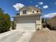 Charming two-story home features a driveway leading to a two-car garage at 7748 Catalina Harbor St, Las Vegas, NV 89131