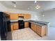 Well-lit kitchen featuring wooden cabinets and modern appliances at 7748 Catalina Harbor St, Las Vegas, NV 89131